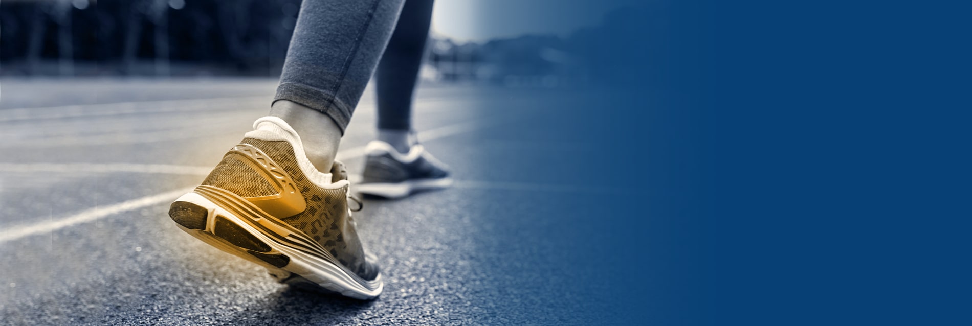 Runner's foot in motion on a track, representing gait and movement